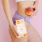 Sweetums Intimate Wipes Peach Scent Unflavored 30 Pack held by a woman with peach, showcasing feminine hygiene.