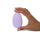 Je Joue Mimi Deux Double Sided Clitoral Vibrator Lilac held in hand showcasing its rounded pleasure dots.