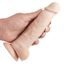 Adam & Eve Adam's True Beige 7 Inch Dildo held in hand showcasing dual-density design and suction cup base.