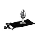 Adam & Eve Clear Gem Anal Plug Small beside a storage pouch, showcasing its polished aluminum design.