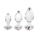 Adam & Eve Red Heart Gem Glass Plug Set featuring three graduated glass plugs with heart-shaped gem bases.