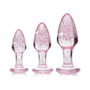 Adam & Eve Glitter Gem Butt Plug Set Pink featuring three graduated plugs with shimmering pink glitter.