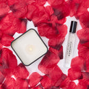 Eye of Love Romantic Attract Her Pheromone Gift Set with candle and perfume surrounded by red rose petals.