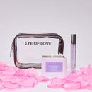 Eye of Love Love in Transit Morning Glow Attract Him Pheromone Gift Set with candle and fragrance on rose petals.