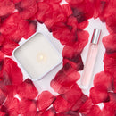 Eye of Love Love in Transit One Love Attract Him Pheromone Gift Set featuring a candle and fragrance on rose petals.