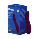 Dame Dip 2.0 Classic Vibrator Plum packaging on display with a sleek design for enhanced pleasure experience.