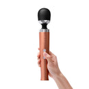 Le Wand Die Cast Rechargeable Massager Rose Gold held in hand with elegant design.