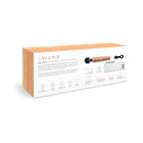 Le Wand Die Cast Rechargeable Massager Rose Gold packaging showcasing features and accessories.