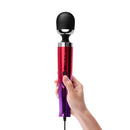 Le Wand Die Cast Plug-In Wand Massager Ombre held in hand, showcasing sleek design and powerful features.