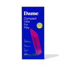 Dame Zig Lipstick Vibrator Pink packaging featuring compact design and triangle tip for portable pleasure.