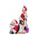Cheeky Pornament Submissive Santa festive ornament featuring a playful Santa and a mischievous figure.