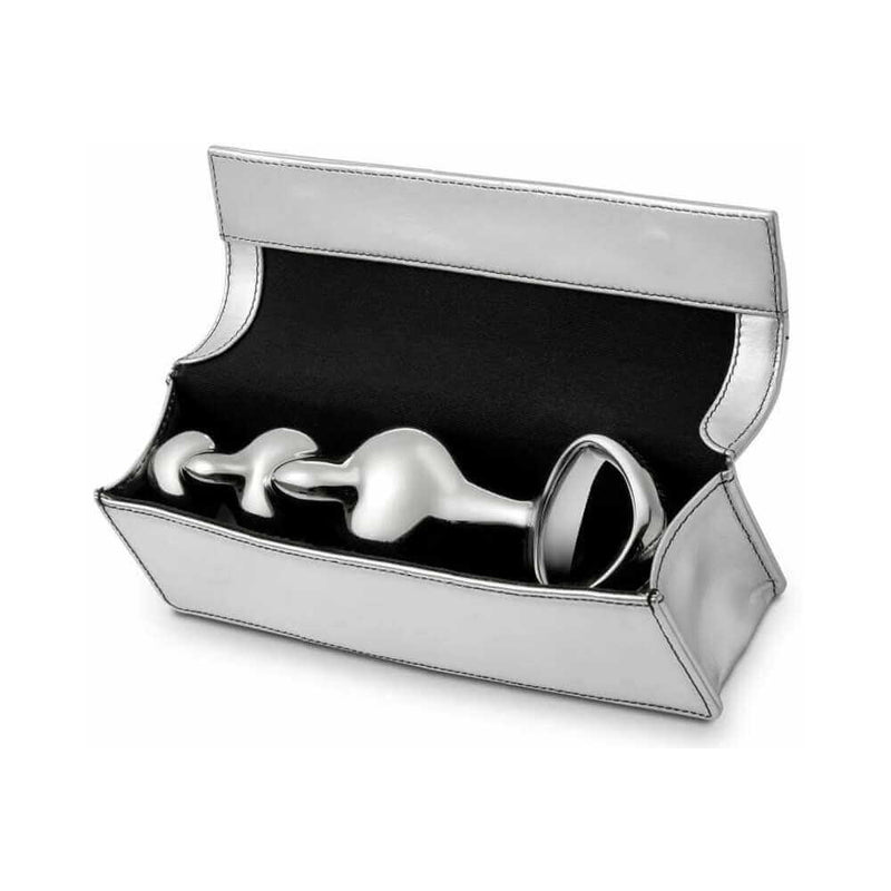 Njoy Disco Stainless Steel Dildo in elegant silver storage case, showcasing luxurious design and smooth sculptural form.