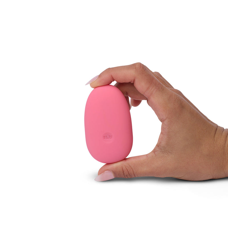 ILY by Je Joue The Pebble Squishy Pebble Shaped Bullet held in hand, showcasing its smooth design and vibrant color.