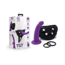 Together Tilt 7 inch Vibrating Dildo & Harness Set Purple with packaging and accessories displayed.