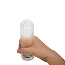 Sleev Individual Pouch Stroker to Go held in hand, compact and pre-lubricated for on-the-go satisfaction.