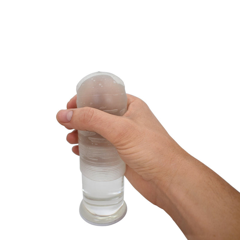 Sleev Individual Pouch Stroker to Go held in hand, showcasing its compact and discreet design for convenient pleasure.