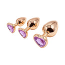 Adam & Eve Rose Gold Pink Heart Anal Plug Training Set featuring three elegant pink heart-shaped plugs.