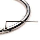 Close-up of Master Series Possession Stainless Steel Locking Collar S with hex key for secure fitting.