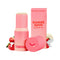 Sweetums Sweet Spot Flavored Fragrance Strawberries and Cream stick with packaging and strawberries backdrop.