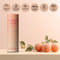 Sweetums Sweet Spot Flavored Fragrance Juicy Peach product with packaging and peaches on display