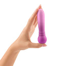 FemmeFunn Anniversary Ultra Bullet Vibrator Orchid held in hand, showcasing its elegant design and compact size.
