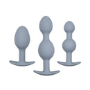 Adam & Eve Vibra-ball Trio Weighted Butt Plug Set Gray featuring three graduated silicone plugs.