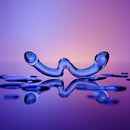 Biird x Wicul OhWii Double Ended Glass Dildo on reflective surface with water droplets.