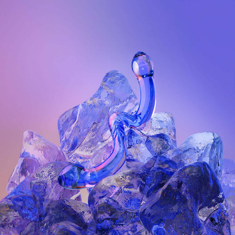 Biird x Wicul OhWii Double Ended Glass Dildo resting on ice crystals, showcasing its elegant design and vibrant color.