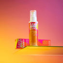 Love To Love Love Me Tender Heating Massage Oil Cotton Candy in vibrant packaging on a colorful background.