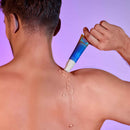 Love To Love Release Me P-spot Stimulating Gel 1 Oz being applied on back for soothing sensation.