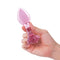 b-Vibe Pink Roses Training Plug Set held in hand, showcasing the elegant design and rose base.