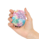 Adam & Eve Ravishing Rose Tapping Clitoral Stimulator Rainbow in a hand, showcasing its vibrant galaxy rainbow pattern.