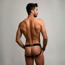 Prowler RED Switch Jock Strap XL Black worn by a model showcasing the 'TOP' patch in a stylish pose.