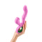 FemmeFunn Pallina Triple Action Thumping Rabbit Vibrator Pink held in hand, showcasing its unique design and features.