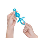 b-Vibe Butties Pop Beaded Silicone Plug in hand, showcasing its flexible beaded design for comfort and sensation.