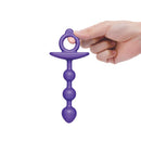 b-Vibe Butties Zip Silicone Anal Bead held in hand, featuring tapered tip and graduated beads for a comfortable experience.