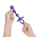b-Vibe Butties Zip Silicone Anal Bead held in hands, featuring graduated beads and a tapered tip for comfort.
