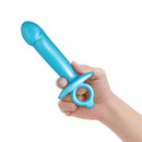 b-Vibe Butties Lil Dil Silicone Anal Dildo in hand, smooth silicone design for beginner-friendly use.