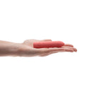 Je Joue Ily The Bullet Squishy Classic Vibrator in a hand showcasing its compact size and soft tip.