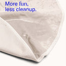 Dame Thro Waterproof Sex Blanket Oat showing a waterproof surface, emphasizing fun with less cleanup.