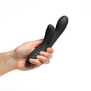 Hand holding the Je Joue Hera Flex Dual Rabbit Vibrator Black, showcasing its sleek design and dual action features.