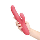 Le Wand Thrust Rabbit Vibrator held in hand, showcasing its luxurious design for dual stimulation and powerful pleasure.