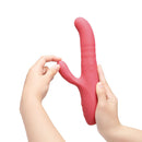 Le Wand Thrust Rabbit Vibrator held in hands, showcasing its ergonomic design for dual stimulation.
