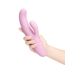 Le Wand Hither Rocking Rabbit Vibrator being held, showcasing its ergonomic design and dual stimulation features.