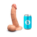 b-Vibe Slipskin Realistic Silicone Dildo 8 inch Curved Mocha next to a blue soft drink can for size reference.