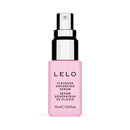LELO Pleasure Enhancing Serum 0.5 Oz in a pink bottle with a spray top for pleasure-boosting stimulation.