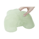 Adam & Eve Glow-in-the-dark Peek-a-booty Masturbator in hand, showcasing its glowing design and realistic features.