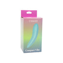 Spectrum Essentials Silicone Compact External Vibrator Blue packaging displayed, featuring a sleek design and vibrant colors.