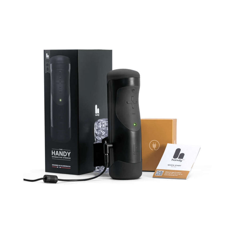 The Handy Interactive Stroker, sleek design with packaging and accessories for enhanced pleasure experience.