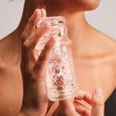 The Handy Dream Collection Lips Sleeve held in hand, showcasing its realistic and textured design for immersive experience.